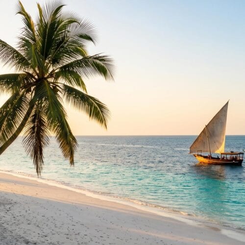 Dhow on turquoise water at sunset on a Kenya and Zanzibar safari